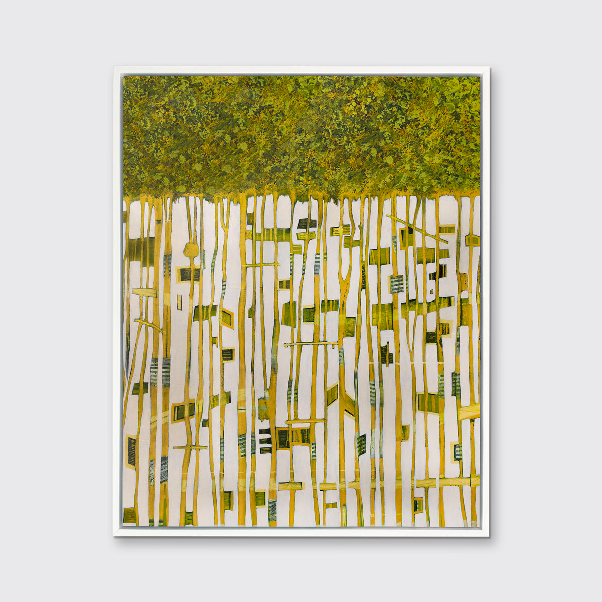 A green, yellow and white abstract print in a white floater frame hangs on a white wall.