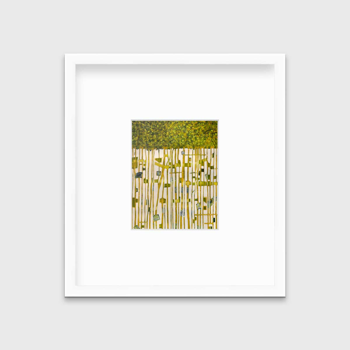 A green, yellow and white abstract print in a white frame with a mat hangs on a white wall.