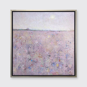 A pink abstract landscape print in a silver floater frame hangs on a white wall.