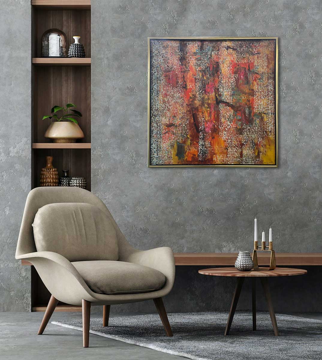A multicolored abstract painting in a warm gold frame hangs on a textured grey wall above a white modern chair, a small round side table with accessories and a wall built-on bookshelf with decor items.