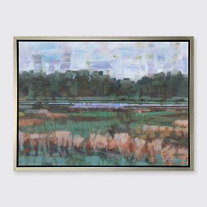 A green, orange and blue abstract landscape print in a silver floater frame hangs on a white wall.