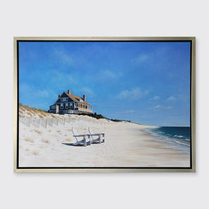 A contemporary realist seascape print in a silver floater frame hangs on a white wall.