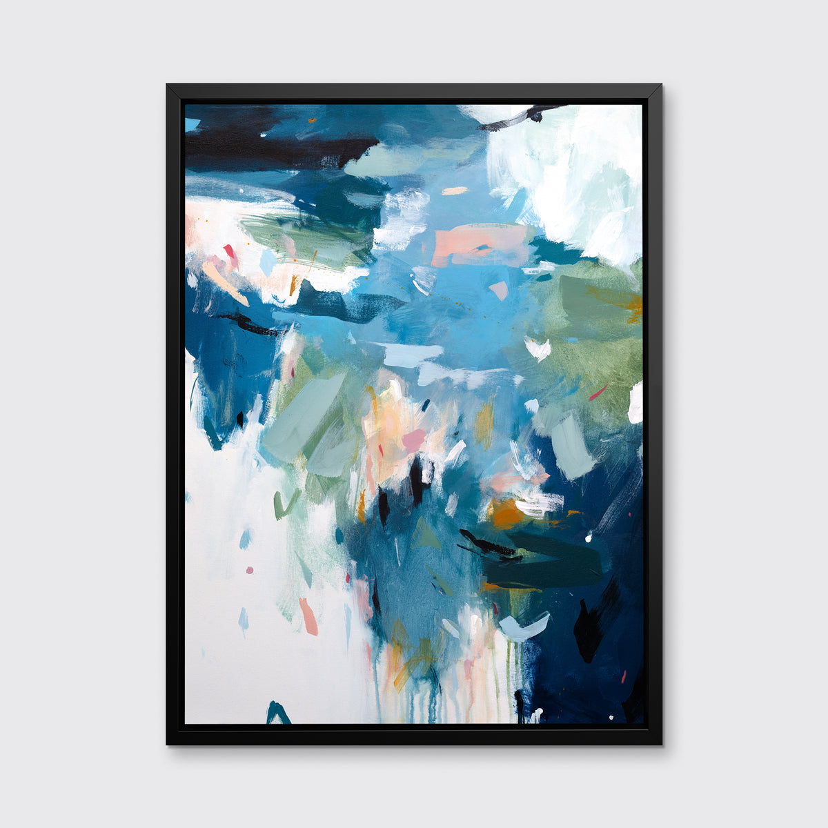 A blue abstract print in a black floater frame hangs on a white wall.