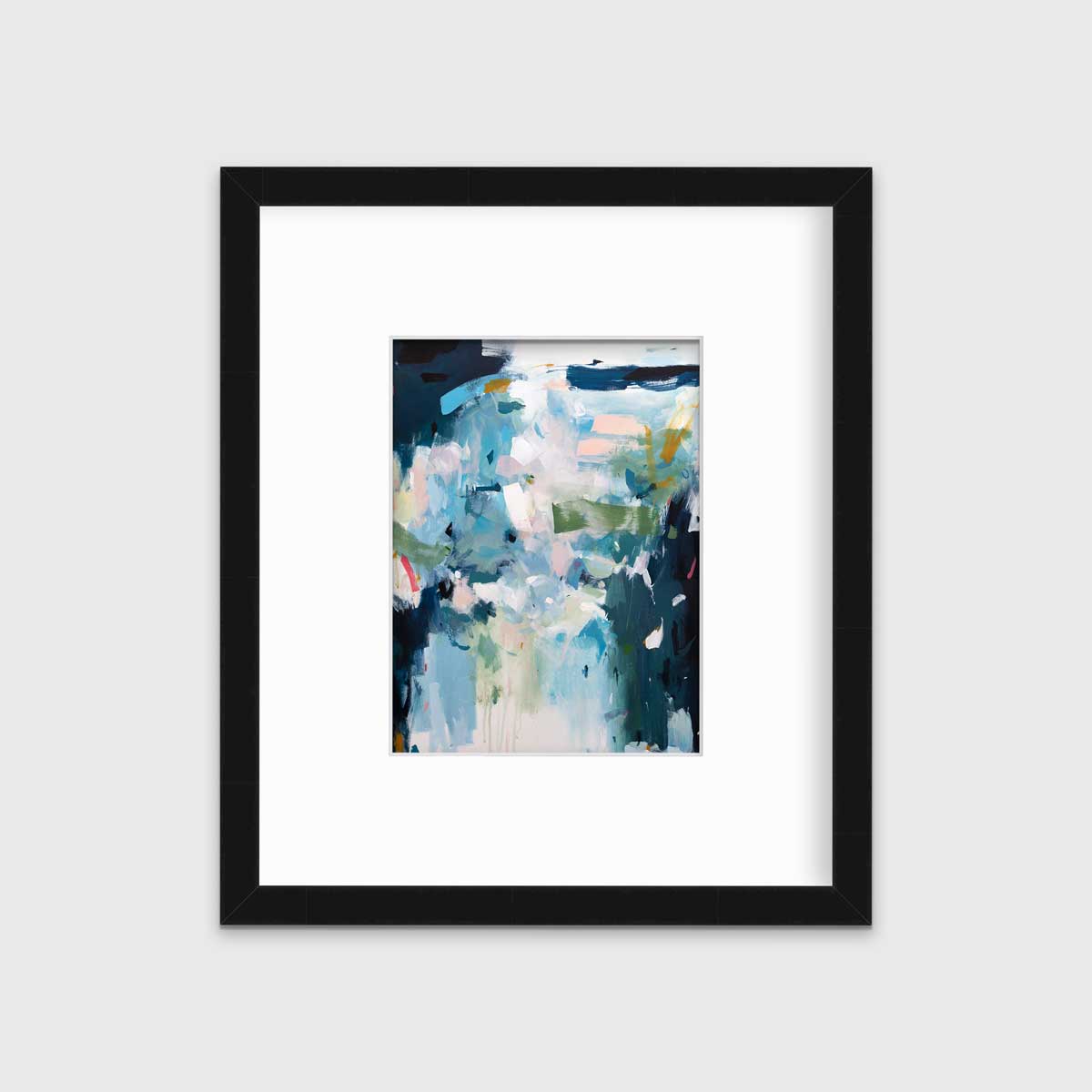 A blue abstract print by Kelly Rossetti in a black frame with a mat hangs on a white wall.