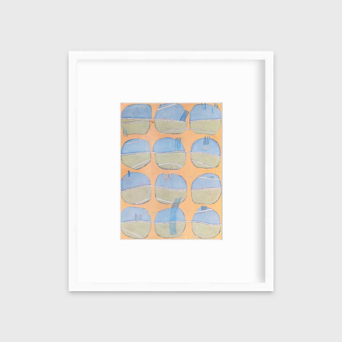A orange, blue, green and white abstract print in a white frame with a mat hangs on a white wall.