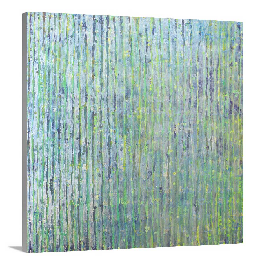 A side-angle view of a green, blue and yellow abstract print on canvas.