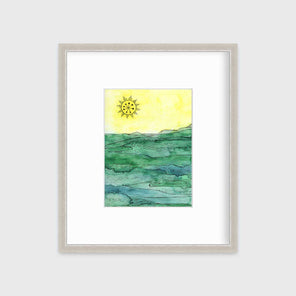 A green and yellow abstract landscape framed in a silver frame with a mat hangs on a white wall.