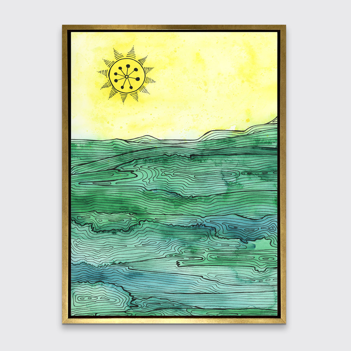 A yellow and green abstract landscape print framed in a gold frame, hangs on a light grey wall.