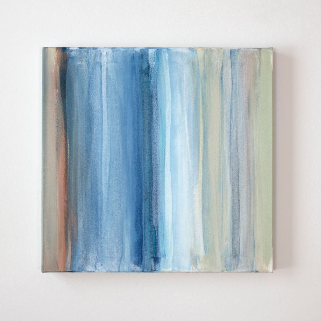 A blue, white, green and tan streaked painting hangs on a wall. Wired and ready to hang.