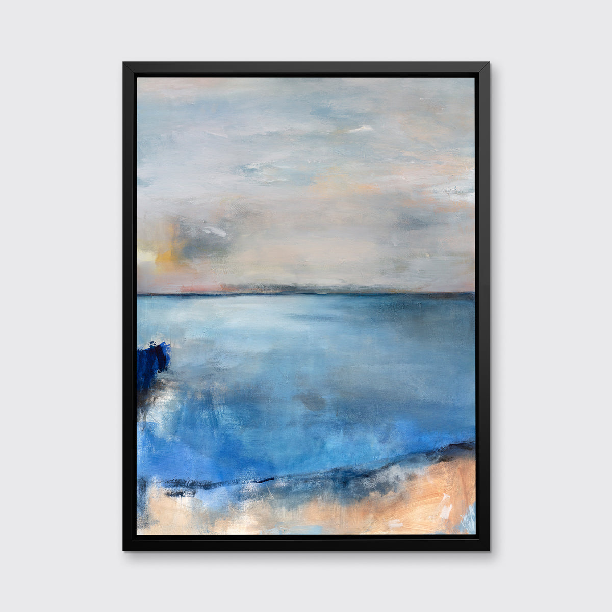 A blue and grey abstract print by Kelly Rossetti in a black floater frame hangs on a white wall.