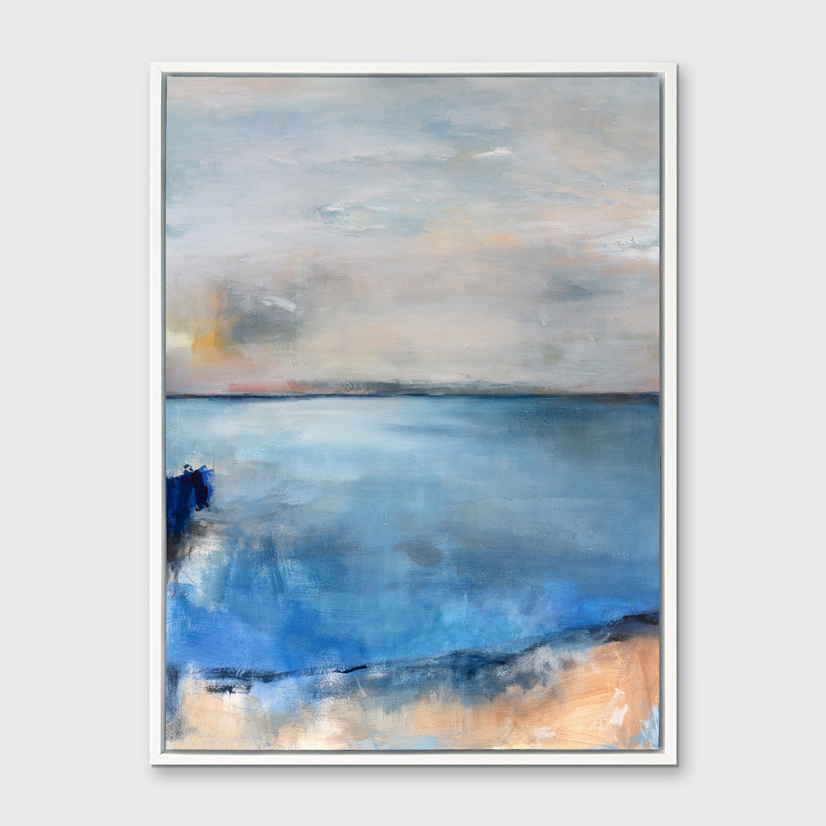 A blue and grey abstract print by Kelly Rossetti in a white floater frame hangs on a white wall.