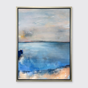 A blue, grey and peach abstract print in a silver floater frame hangs on a white wall.
