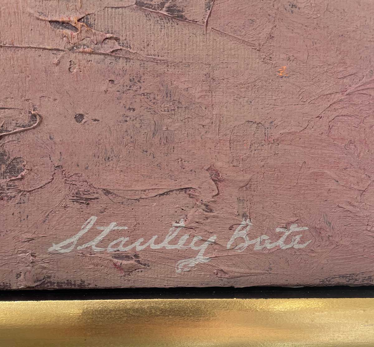 A close up of the artist's signature, Stanley Bate, in the bottom right hand corner.