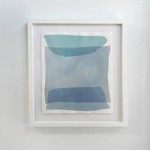 Blue and green shapes overlap in this painting by Nealy Hauschildt in a white frame floating above a white matte hangs on a white wall.