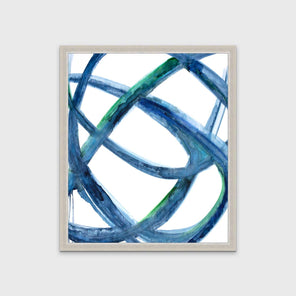 A blue, green and white abstract print in an unmatted silver frame hangs on a white wall.