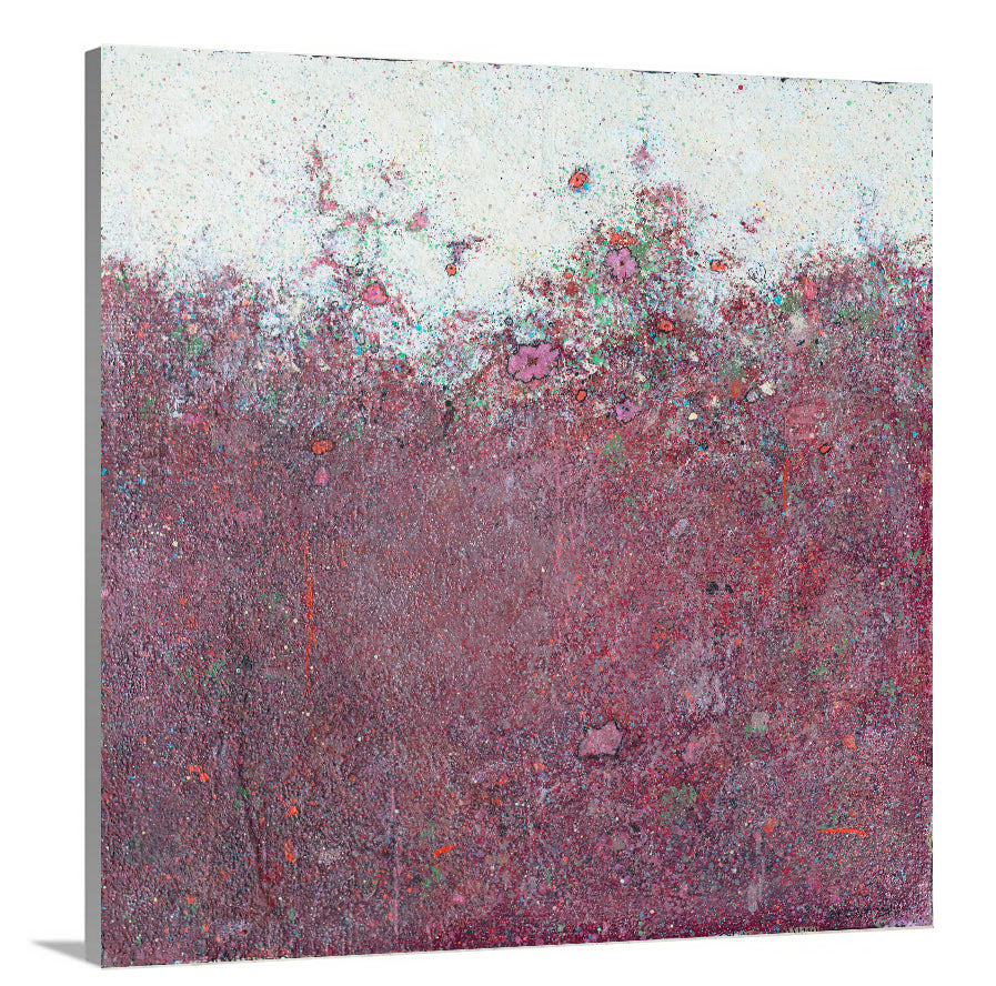A side-angle view of a dark red abstract landscape print on canvas.