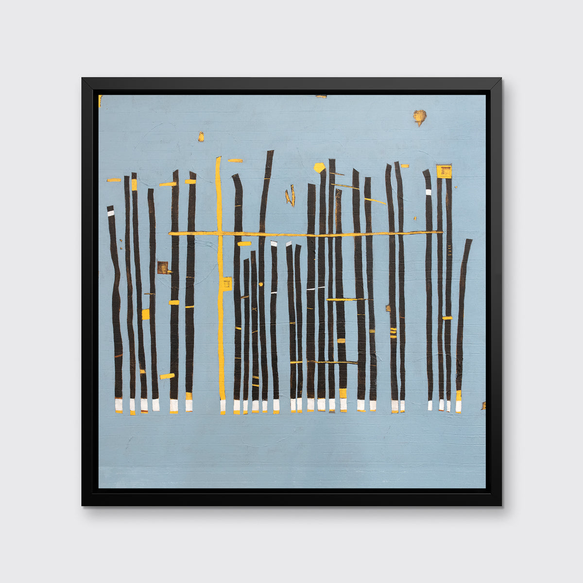 A blue, black and yellow abstract print in a black floater frame hangs on a white wall.