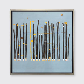 A blue, black and yellow abstract print in a silver floater frame hangs on a white wall.