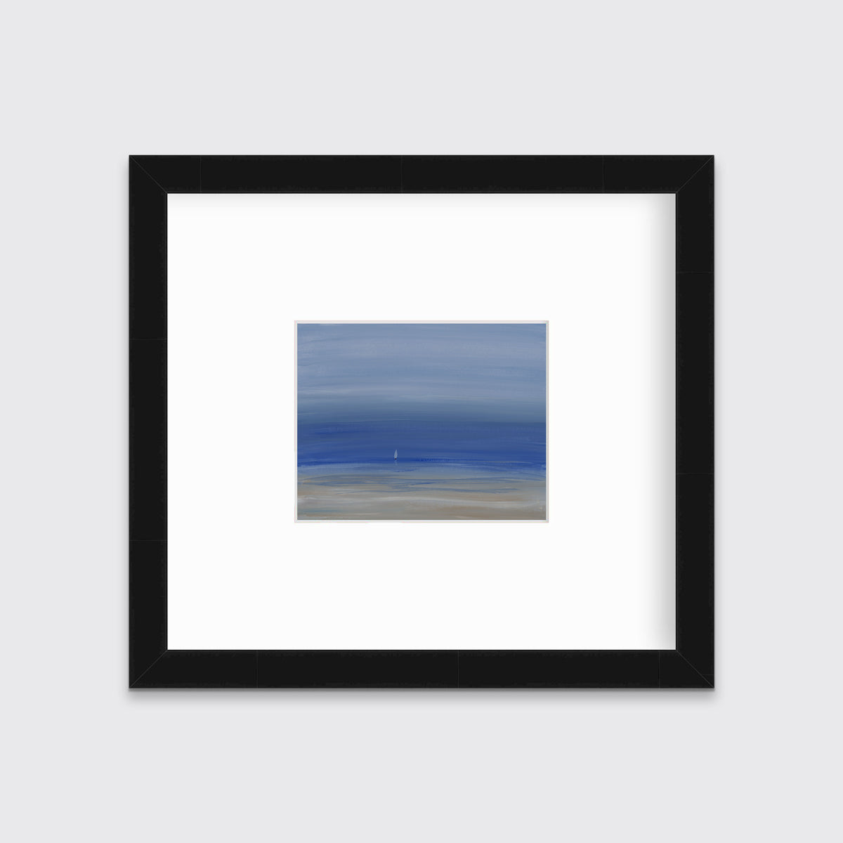 A blue and beige abstract seascape print in a black frame with a mat hangs on a white wall.