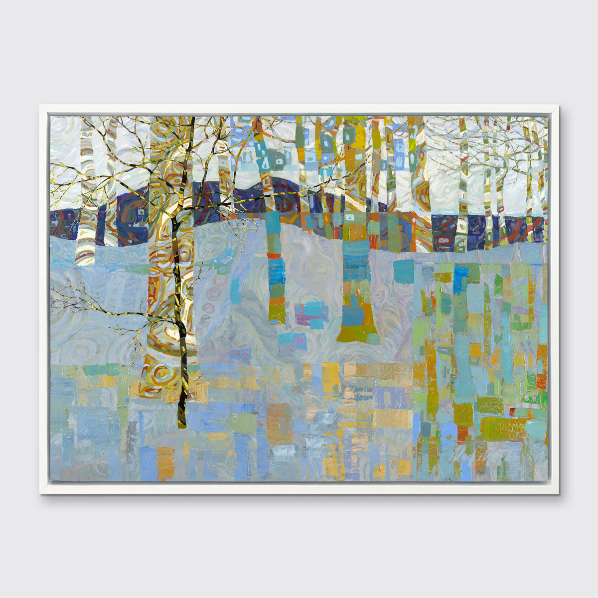 A multicolored abstract landscape in a white floater frame hangs on a white wall.