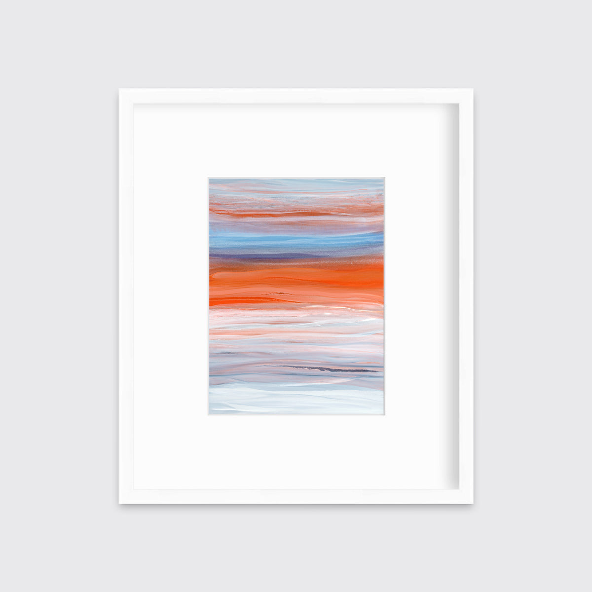 A blue, orange, light pink and white abstract print in a white frame with a mat hangs on a white wall.