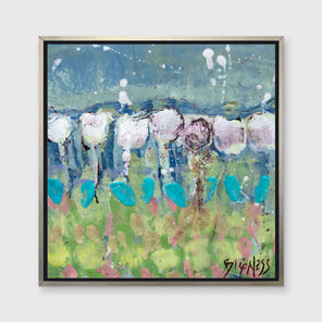 A teal, green and white abstract floral print in a silver floater frame hangs on a white wall.