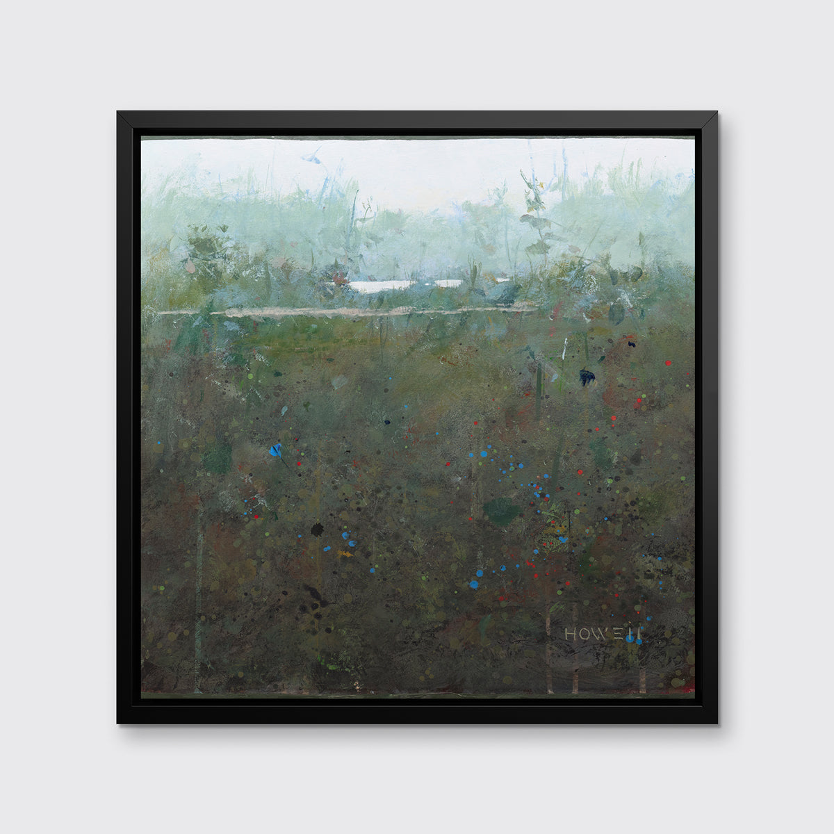 A dark green and grey abstract landscape print in a black floater frame hangs on a white wall.