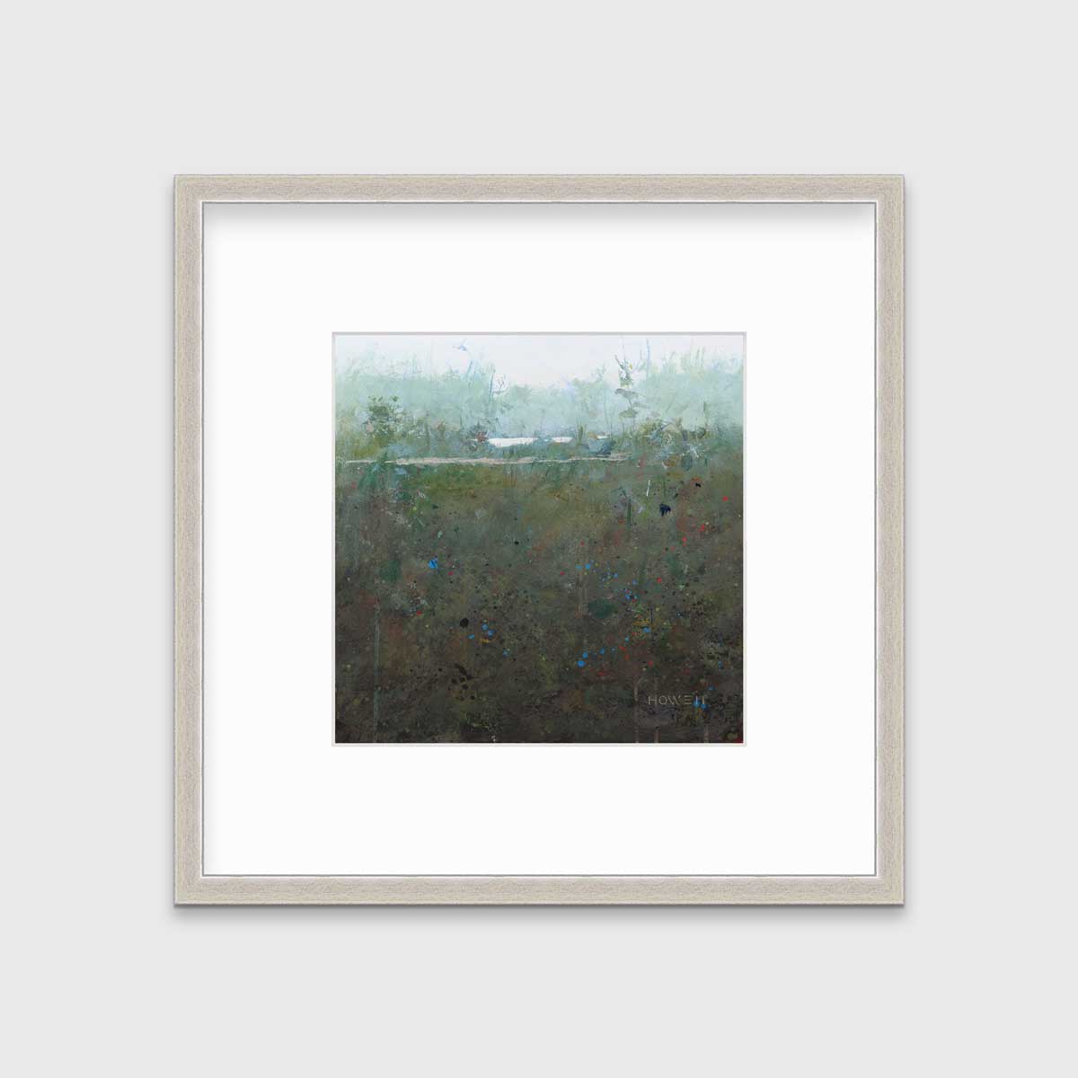 A dark muted green abstract landscape print in a silver frame with a mat hangs on a white wall.