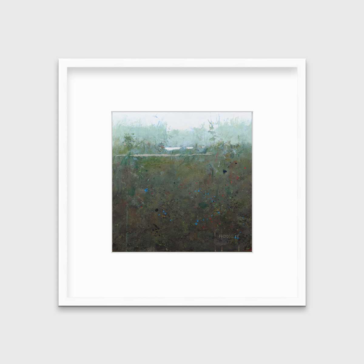 A dark muted green abstract landscape print in a white frame with a mat hangs on a white wall.