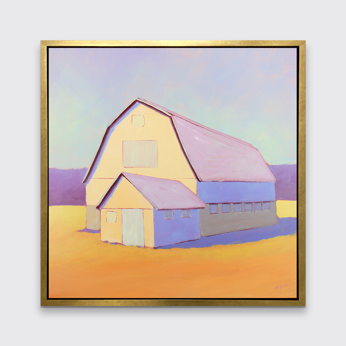 A lavender, light yellow and orange landscape print of a barn in a gold floater frame hangs on a white wall.