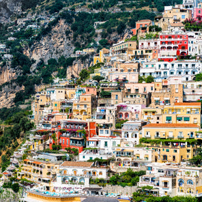 A photograph of multicolored buildings on a cliffside in Positano, Italy.