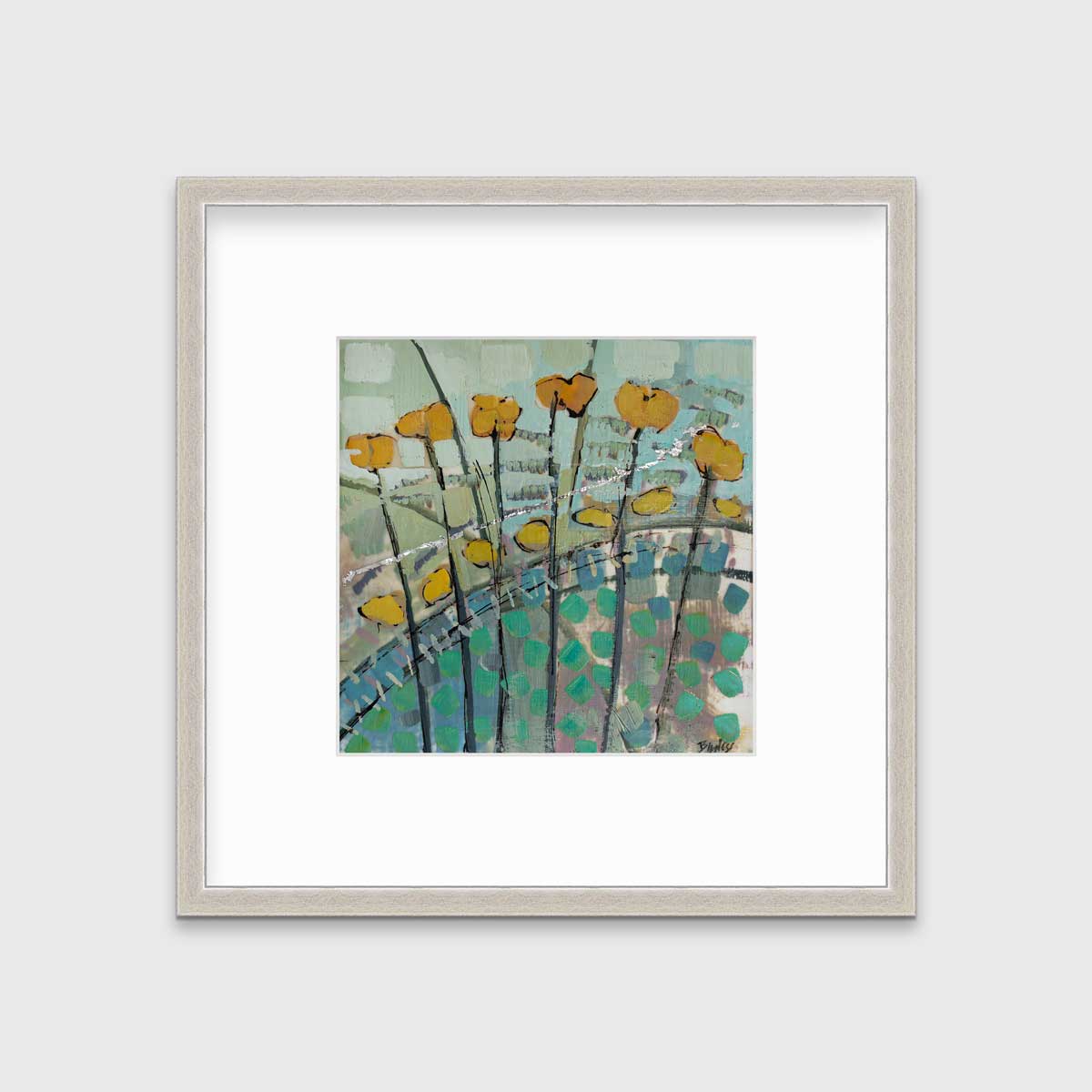 A blue, yellow, and green abstract floral print in a silver frame with a mat hangs on a white wall.