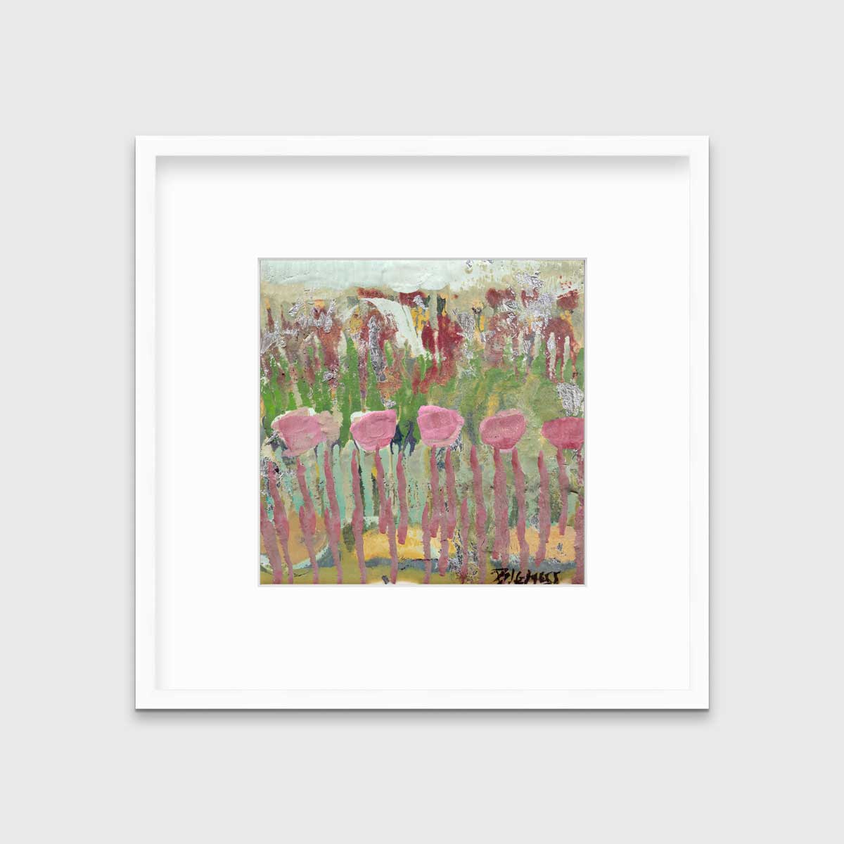 A green, pink and teal abstract floral print in a white frame with a mat hangs on a white wall.