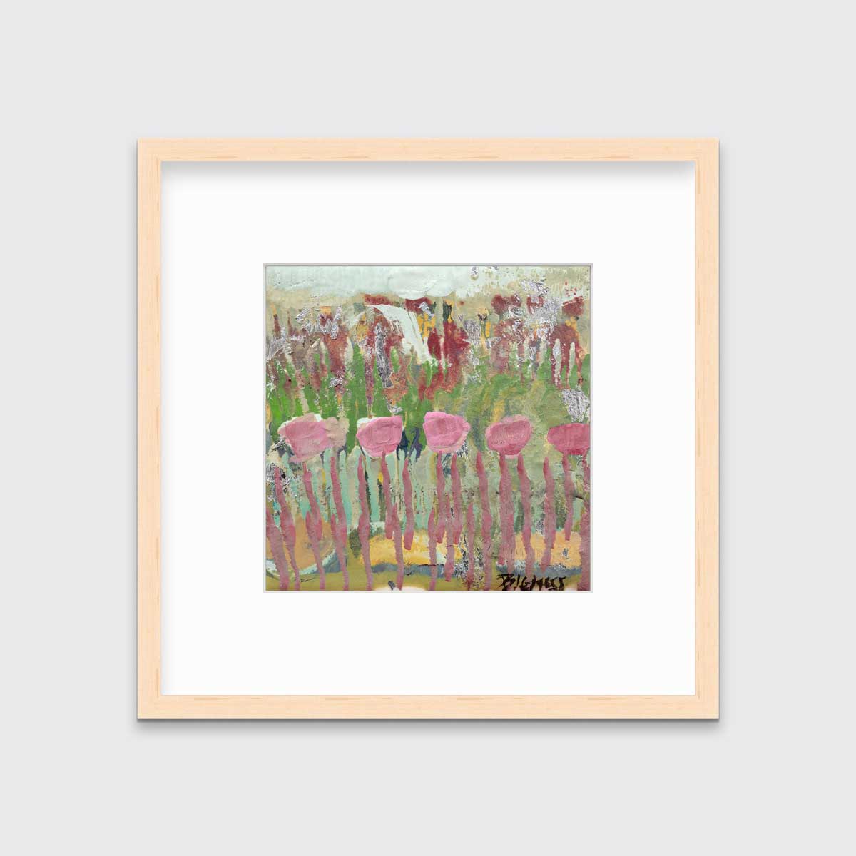 A green, pink and teal abstract floral print in a natural wood frame with a mat hangs on a white wall.