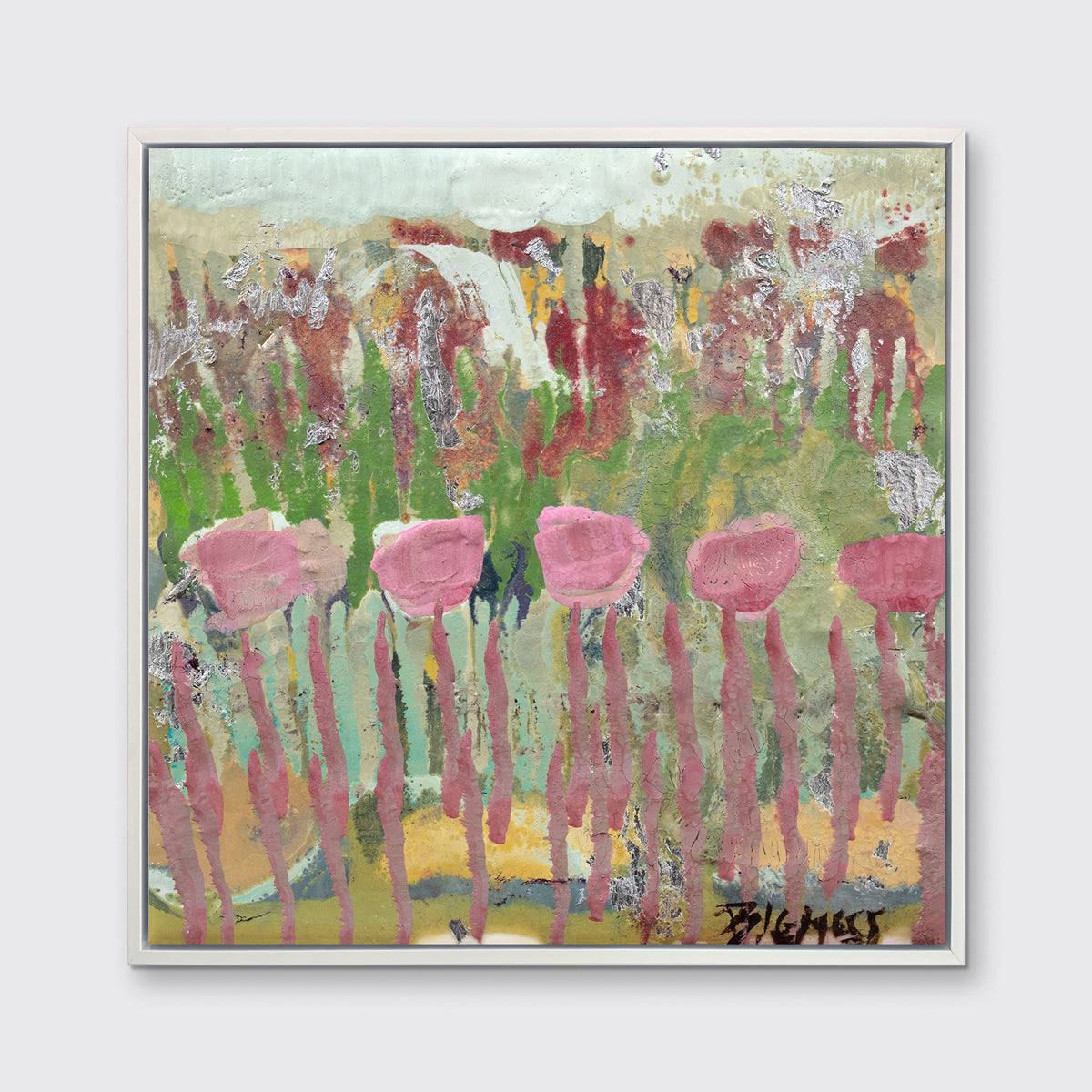 A green, pink and teal abstract floral print in a white floater frame hangs on a white wall.