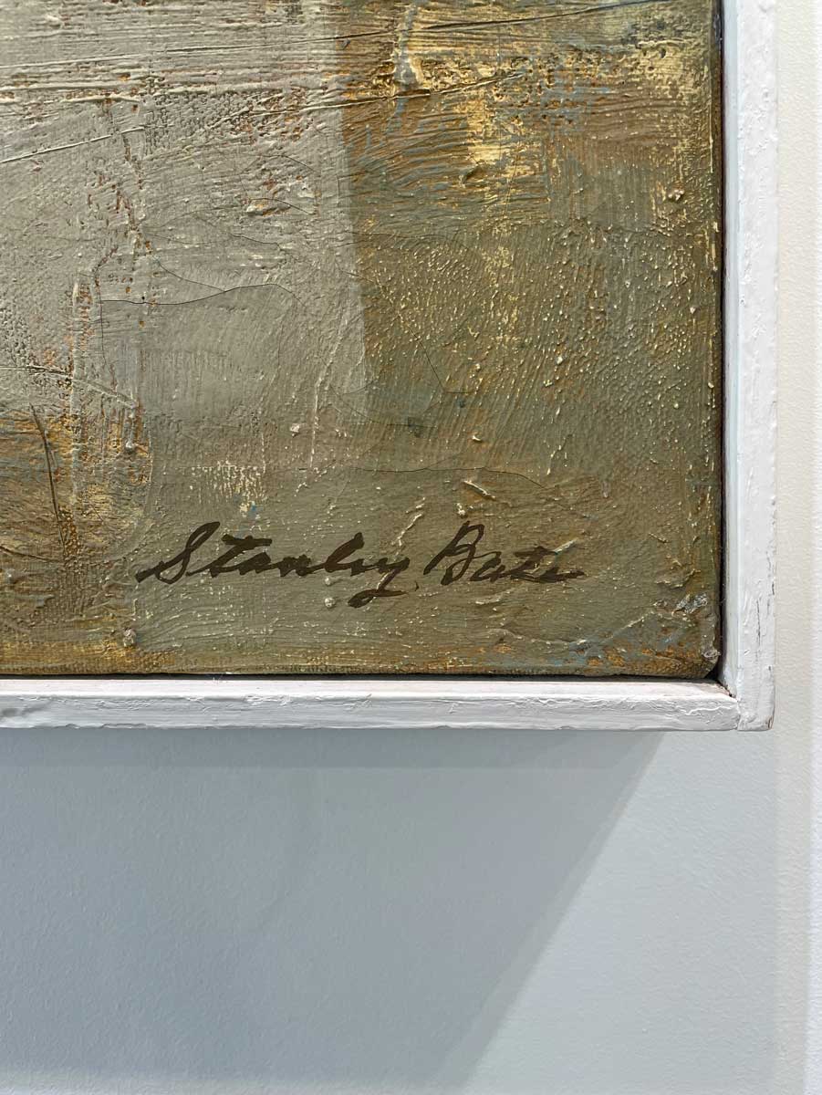 A close up of the artist's signature in the bottom right hand corner.