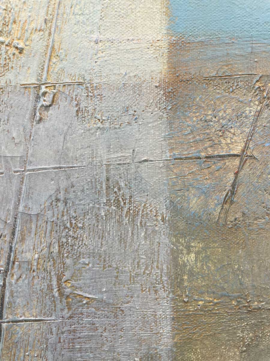 A close up of the texture of white and light blue paint.