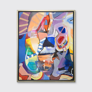 A multicolored abstract print in a silver floater frame hangs on a white wall.