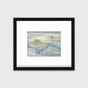 A brown, grey and light green abstract landscape print in a black frame with a mat hangs on a white wall.
