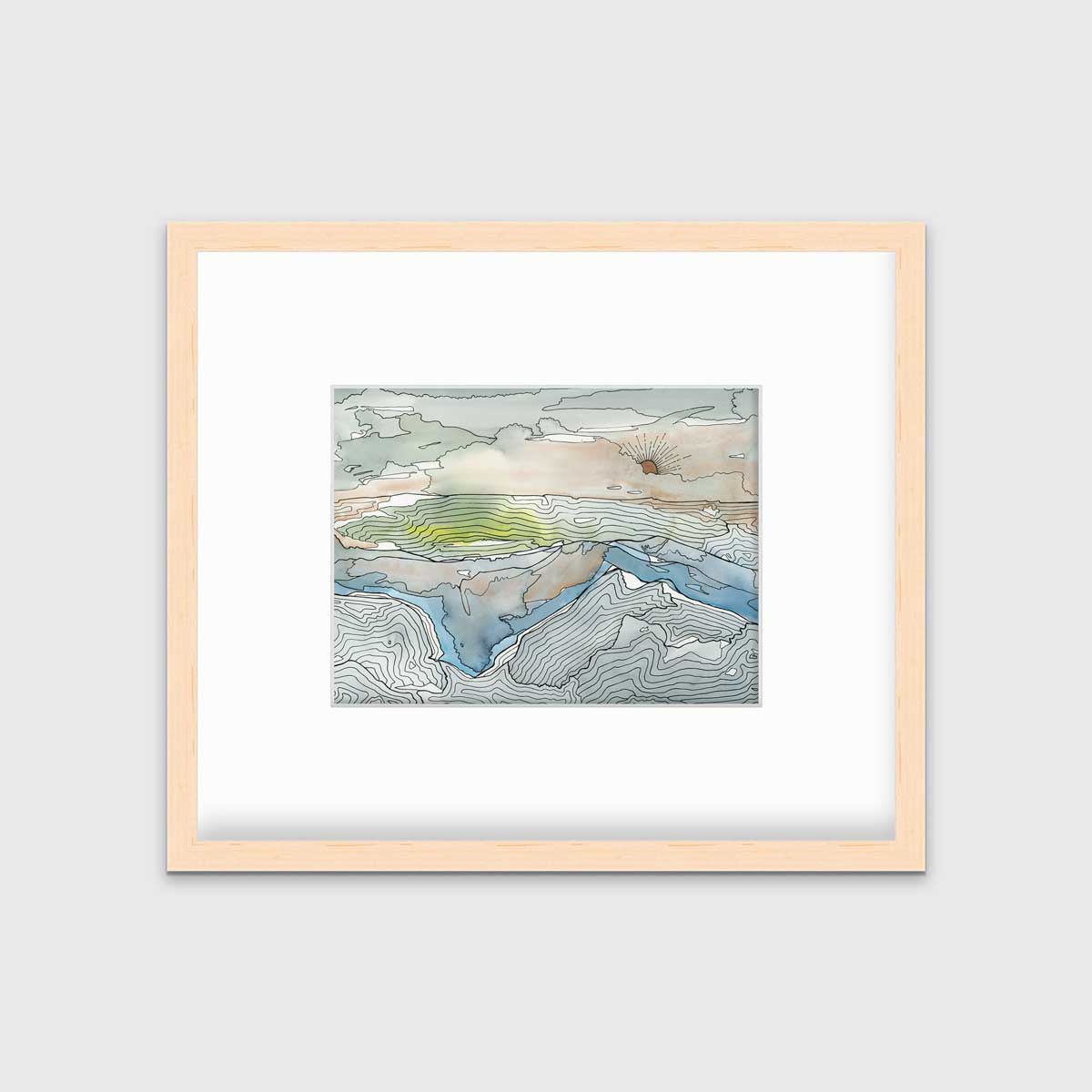 A brown, grey and light green abstract landscape print in a natural wood frame with a mat hangs on a white wall.