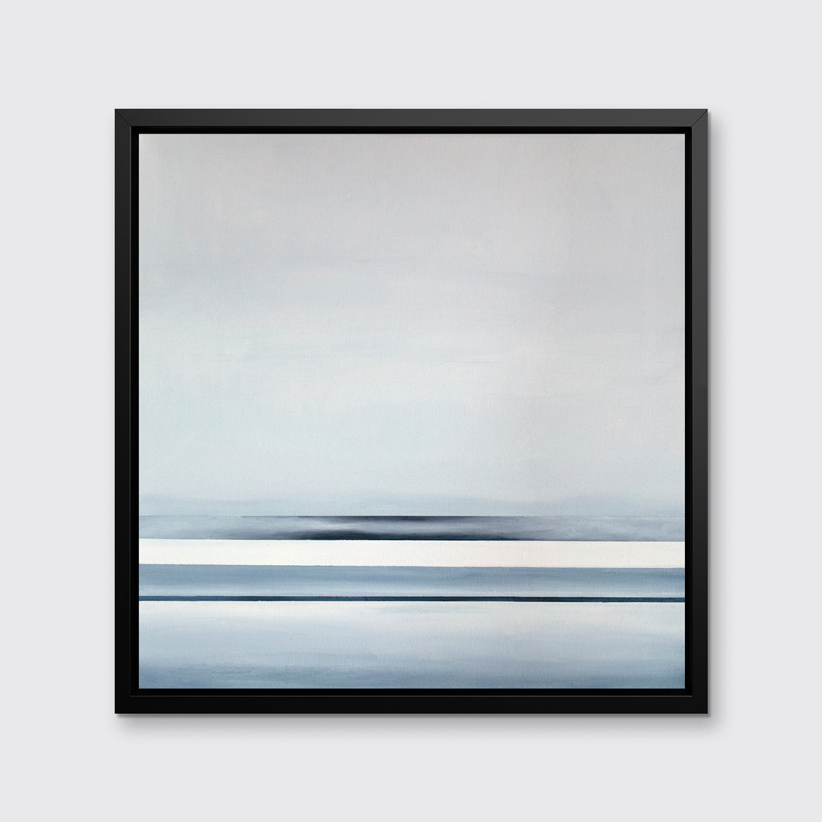 A blue and white linear abstract landscape in a black floater frame hangs on a white wall.