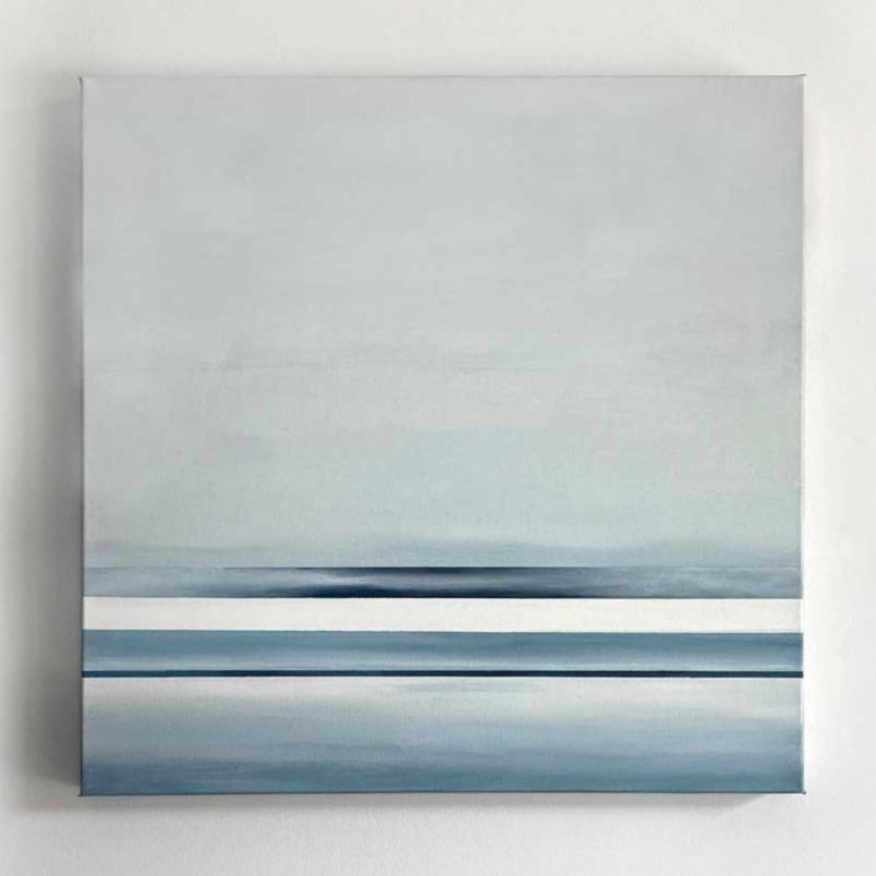 Abstract painting of blue and white horizontal lines below a grey color block hangs on a white wall.