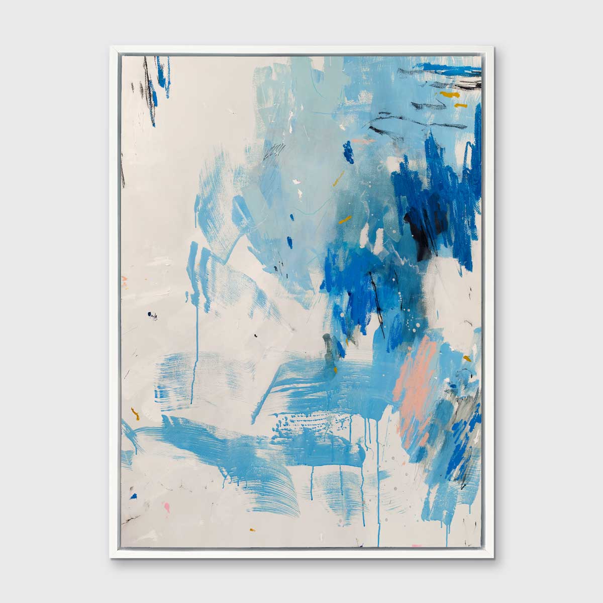 A blue, peach and white abstract print in a white floater frame hangs on a white wall.