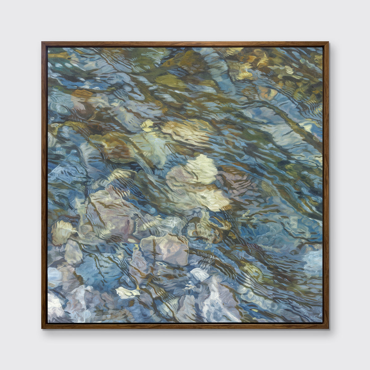 An abstract river bed print in an oak wood floater frame hangs on a white wall.