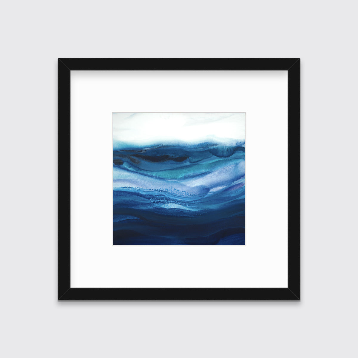 A blue, teal and white abstract print in a black frame with a mat hangs on a white wall.