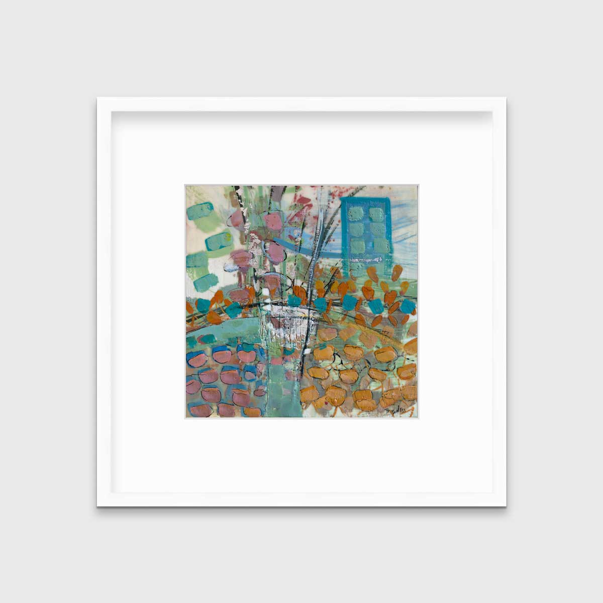 A multicolored abstract print, matted and framed in a white frame hangs on a grey wall.