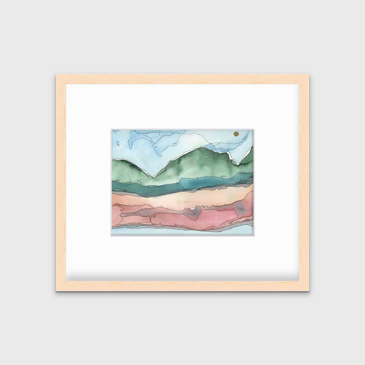 A blue, green and red abstract landscape print in a natural wood frame with a mat hangs on a white wall.