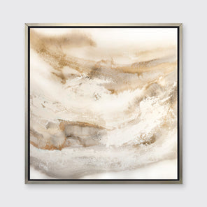 A gold, silver, white and beige abstract print in a silver floater frame hangs on a white wall.