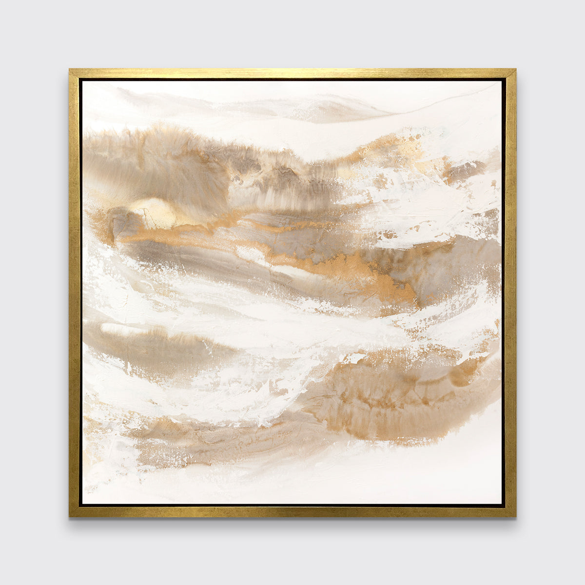 A gold, silver, white and beige abstract print in a gold floater frame hangs on a white wall.