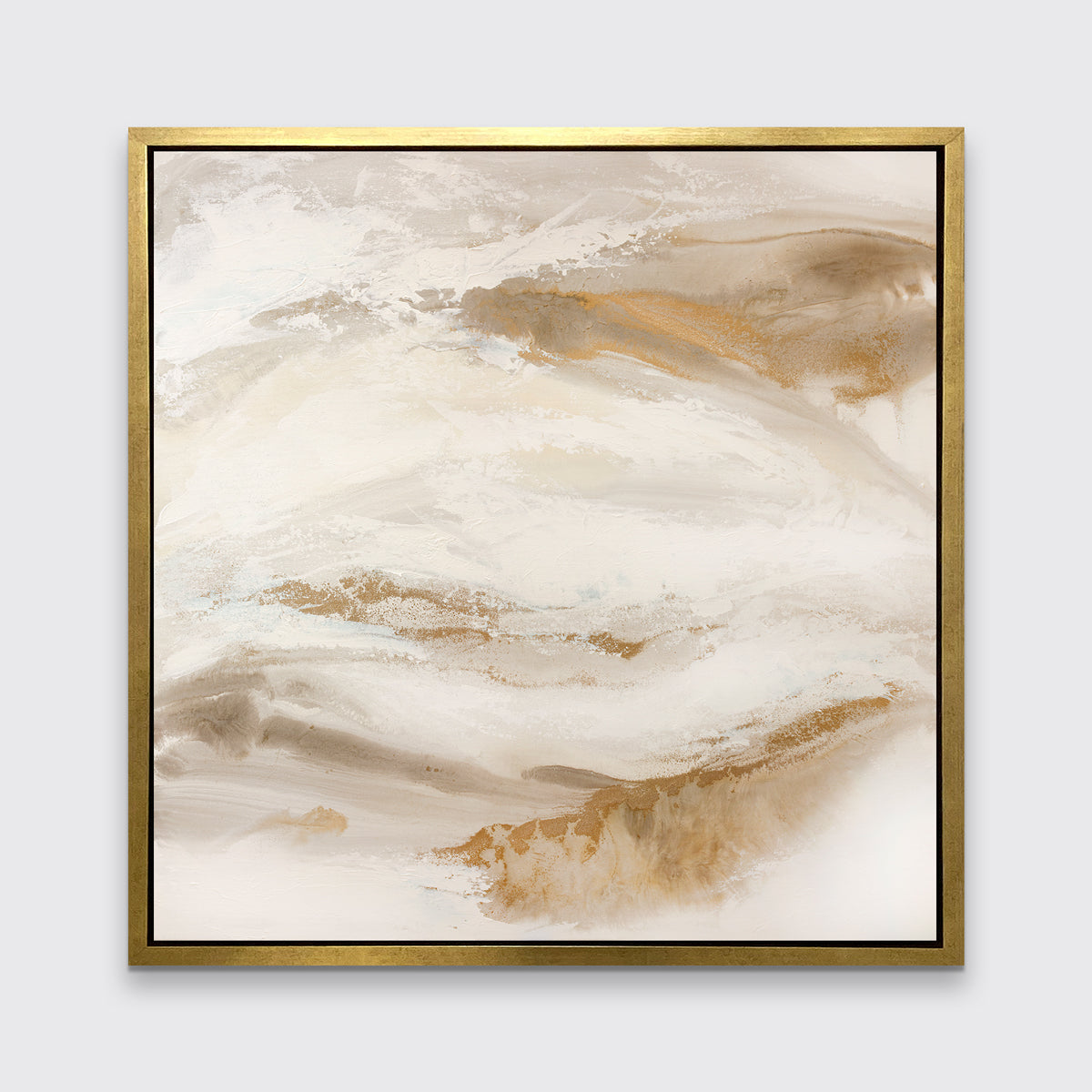 A gold, silver, white and beige abstract print in a gold floater frame hangs on a white wall.